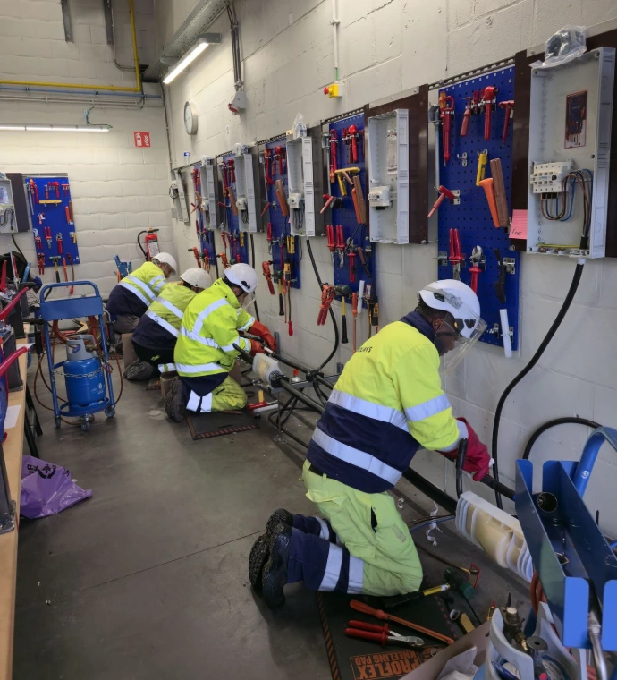 man working on power cable